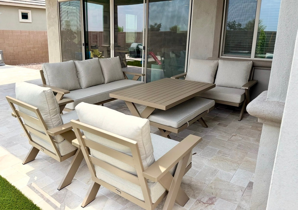 Gracie aluminum outdoor dining set arranged on a covered patio
