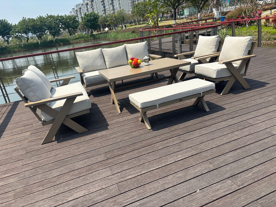 Gracie aluminum patio set with dining table on a waterfront deck